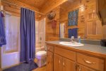Full bathroom with tub and stand up shower